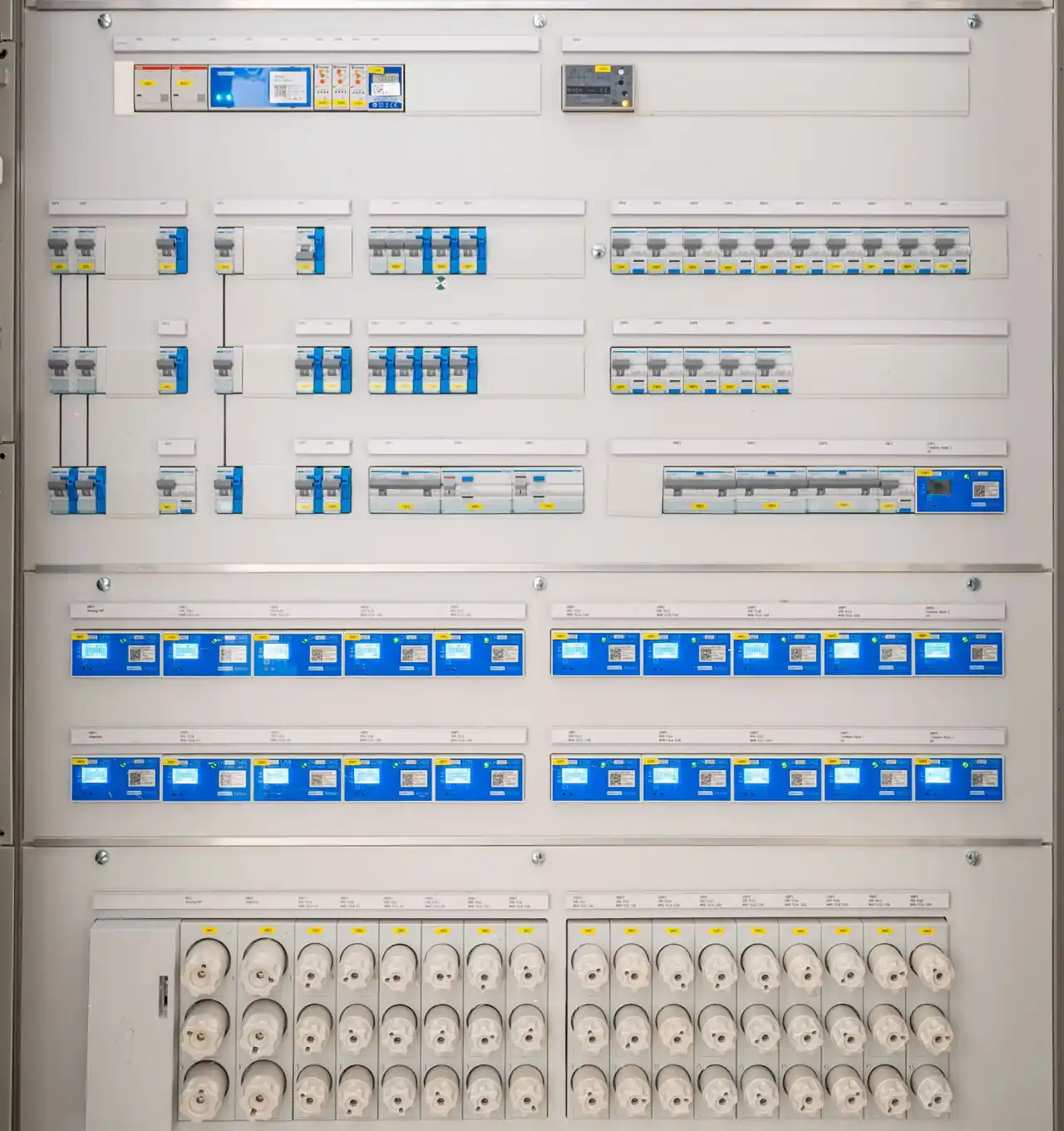 Organized commercial electrical distribution board with breakers and metering