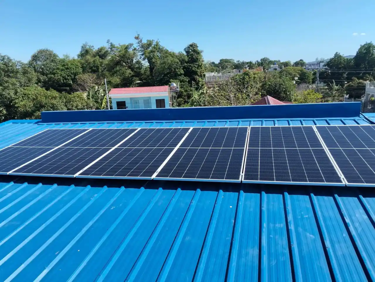 Newgen solar array installed on a blue metal roof